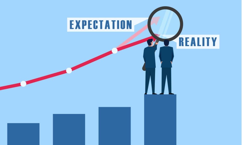 A bar chart. Two men stand on the tallest bar examining the intersection between expectation and reality.